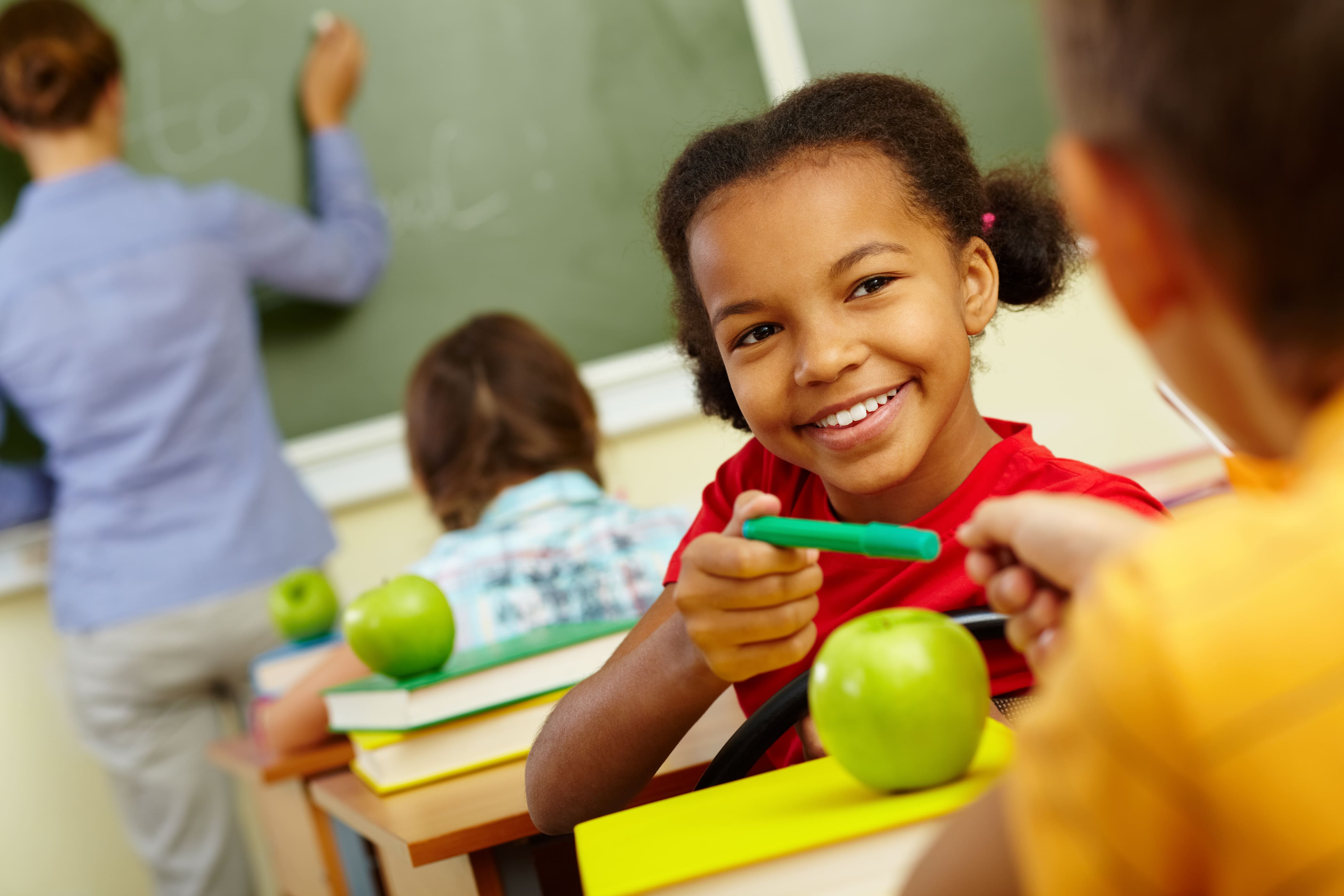 Students sharing a pencil